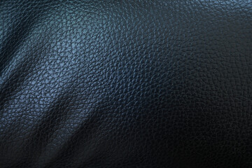 Black background. Leather car seat covers and sofas.