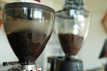 Fresh coffee beans in a coffee grinder