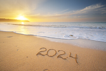 2024 year on the sea shore during sunset.