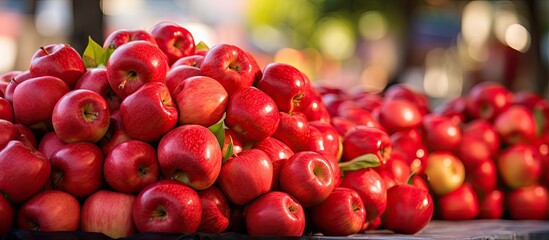 Red apples displayed at Thai street market.