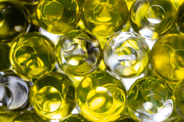 Abstract texture, yellow and white  crystalline balls of hydrogel for the background. Hydrogel beads. Close up , soft focus.