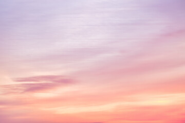 A beautiful sky tinted by the sun leaving vibrant shades of gold, pink, blue and multicolored. Clouds in the twilight evening and morning sky. Image of a cloudy sky in the evening and during the day