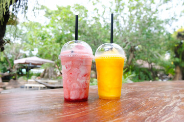 Fruit smoothies, glasses of orange juice on the table.