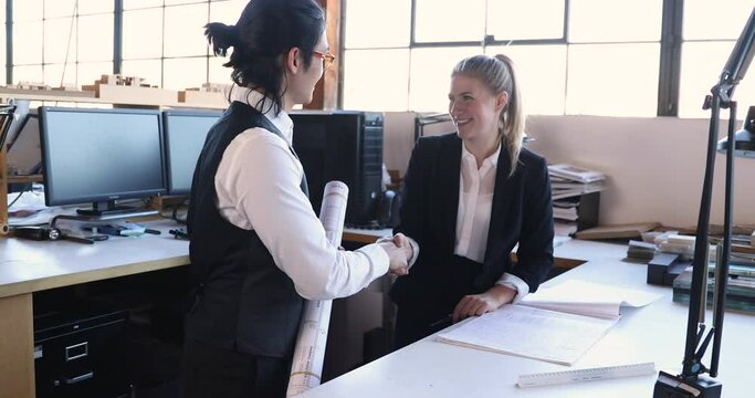 Diverse Insights in Real Estate, Male and Female Professionals Planning and Managing Property Development, 4K 60fps slow motion