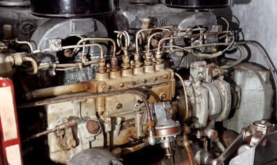Working on the diesel engine of a vintage publc transport bus.