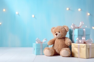 bear and gifts sitting next to a blue background