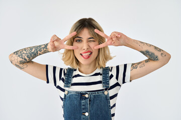 Funny gen z blonde young woman, girl with short blond hair tattoos wearing striped t-shirt and...