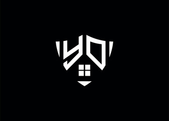 Obraz premium Real estate letter YO shield shape logo and house building vector template.