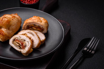 Delicious fresh meat roll made from chicken fillet, mushrooms, spices and herbs