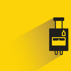 travel bag with shadow on yellow background