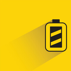 battery with shadow on yellow background