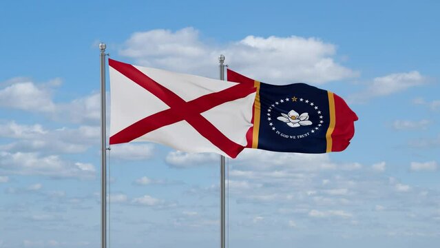 Mississippi and Alabama US state flags waving together on cloudy sky, endless seamless loop