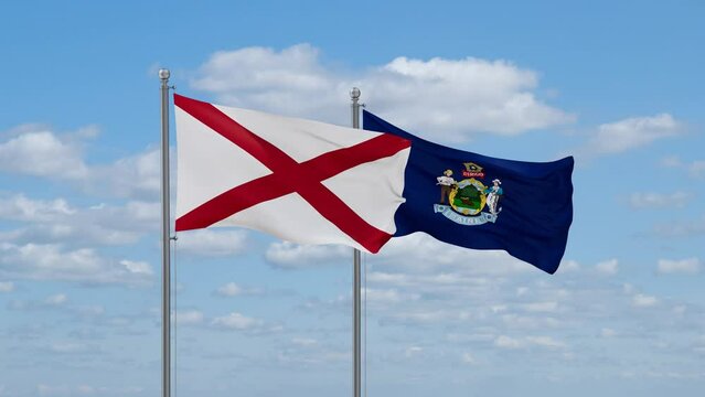 Maine and Alabama US state flags waving together on cloudy sky, endless seamless loop