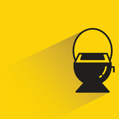 toilet bowl and wc with shadow on yellow background