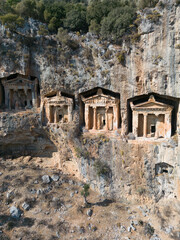 Dalyan, Mugla. Turkey Kings tombs in the cliff face Kaunos Dalyan, Turkey. Aerial view . High quality photo - 693878493