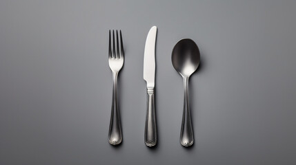 Spoon knife fork on grey background