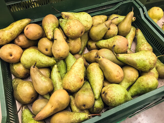Pears in a box, fruit for food ripe green color ,lie in a box in supermarket .concept vitamins healthy food
