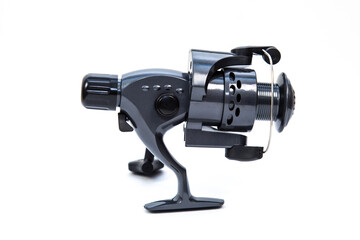 Fishing gear - reel for fishing rod, white background.
