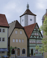 Obraz premium Buildings in a town with a tower in the background 3d illustration