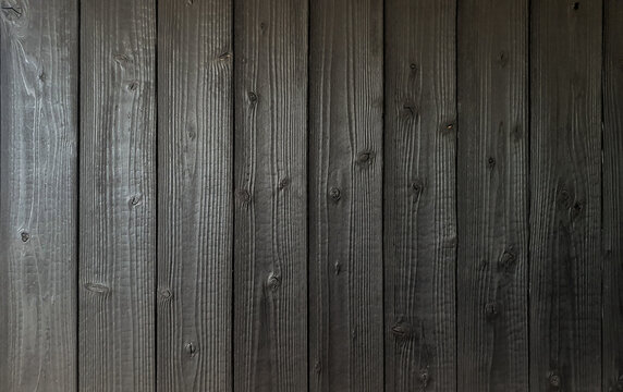 Black burnt wooden wall background