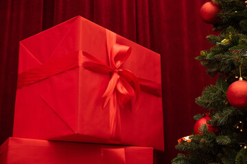 Christmas tree and gifts on a background. Red color box. - 693901029