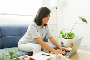 Happy woman learning English online and studying at home