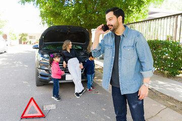 Family calling for help because of their broken down car