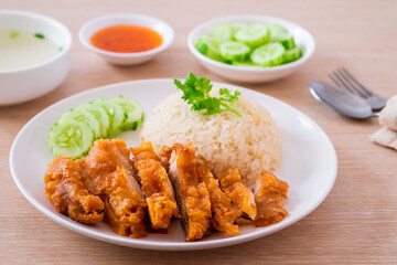 Hainanese chicken rice with fried chicken or oily rice with fried chicken and chili sauce