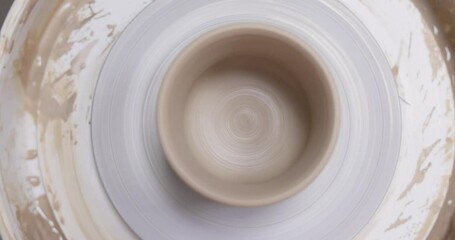 ceramic cup on on pottery wheel, Close up, top view