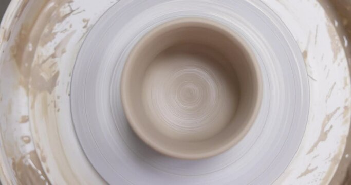 ceramic cup on on pottery wheel, Close up, top view