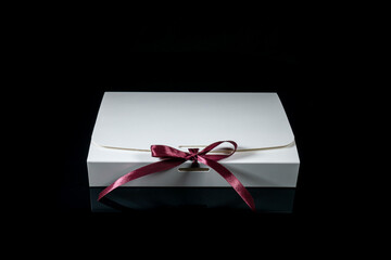 Man gift concept. gift box with luxury bow on dark background. Horizontal with copy space.