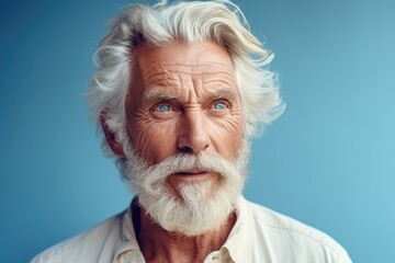 A picture of a man with a white beard wearing a white shirt. Suitable for various uses