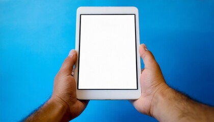 Hands holding white screen tablet, isolated on blue background