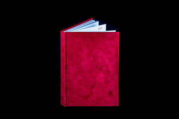 close up of a blank velour fluffy notebook on black background with clipping path