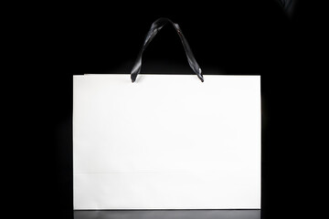 Recyclable white paper bag for purchases, gifts and takeaway food mock up on black background....