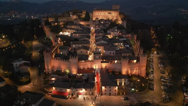 Italy, 14 December 2023 - Night aerial view of the medieval village of Gradara on the border with Romagna in the province of Pesaro and Urbino in the Marche region