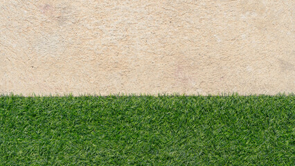 Above view of half artificial grass green color and cement floor. for background and textured.