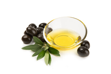 Bowl of fresh olive oil and olives with leaves isolated on white background. Delicious olive oil in a glass bowl. olive oil bottle.