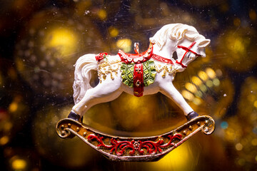 new year retro toy horse on a golden background