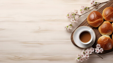 Obraz na płótnie Canvas Coffee and Buns on Wooden Table