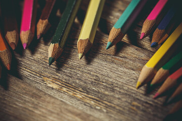 Many colored pencils on a wooden surface, pencils for drawing - Powered by Adobe
