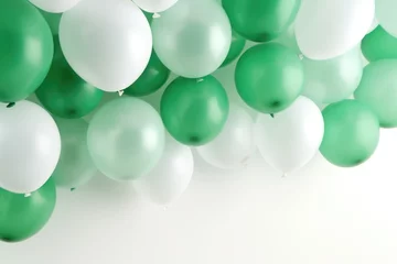 Foto op Canvas A bunch of green and white balloons arranged on a wall. Suitable for festive occasions and celebrations © Fotograf