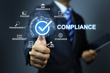 Compliance concept with businessman thumb up checkmark to applied standard and regulation for...
