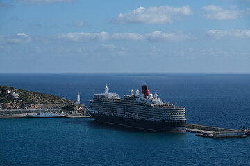 Classic british luxury ocean liner cruiseship cruise ship in Ibiza port with red, black and white hull