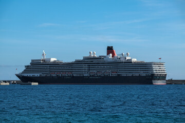 Classic british luxury ocean liner cruiseship cruise ship in Ibiza port with red, black and white...