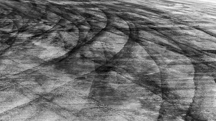 Tire track mark on asphalt tarmac road race track texture and background, Abstract background black...