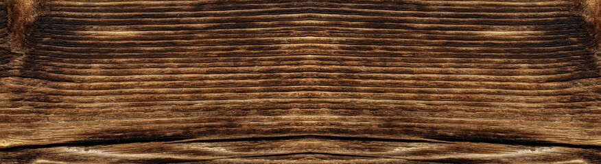 Texture of weathered and sun-burnt boards close-up