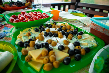 Festive table with juicy vegetables, cheese and drinks close-up, life style