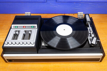 Vintage turntable vinyl record player with black vinyl