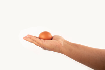 an egg in the palm of his hand